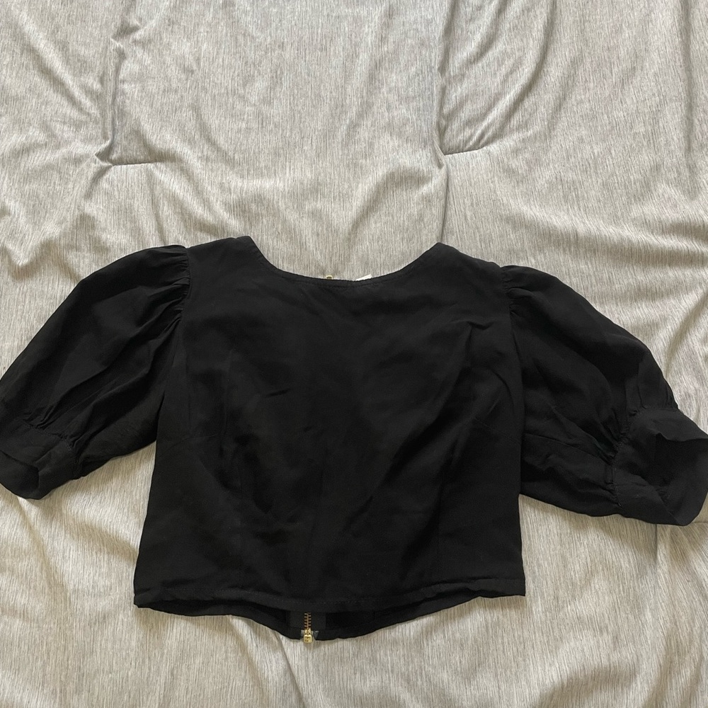 simple black top with puffy sleeves. size small. brand: valija.